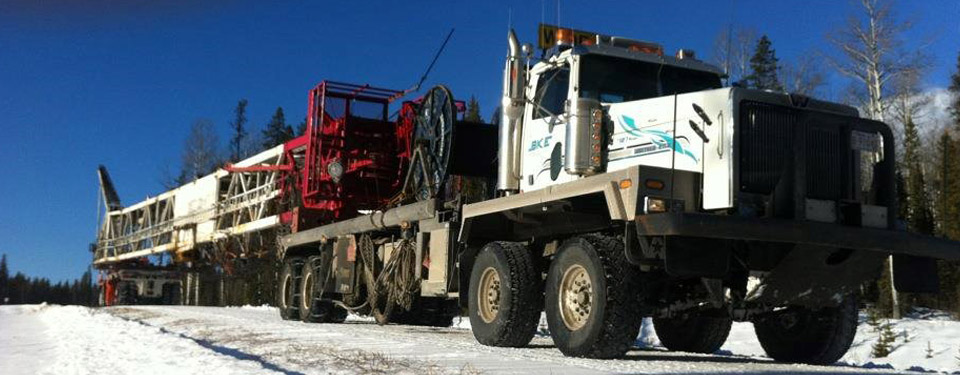 Transport Truck hauling crane