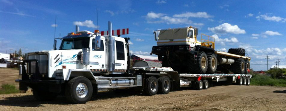 Transport Truck hauling heavy equipment